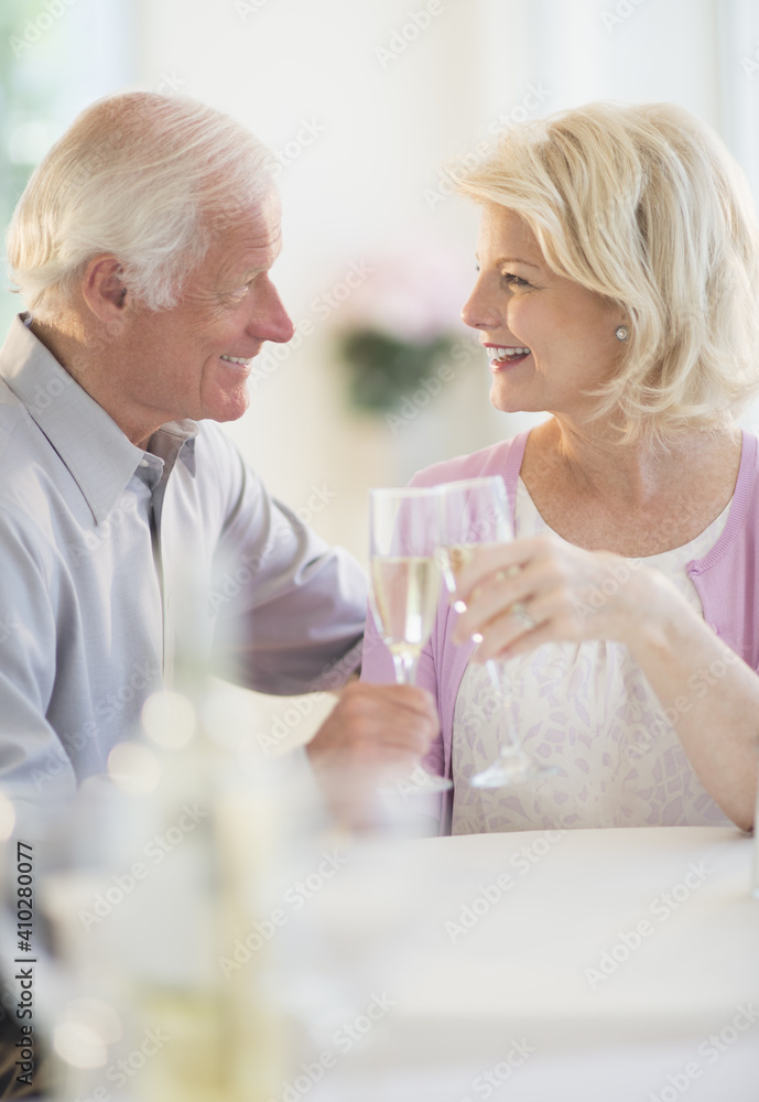 Couple enjoying champagne restaurant Couple enjoying champagne restaurant