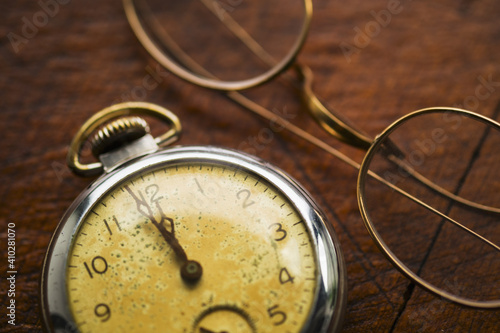 Antique clock and glasses photo