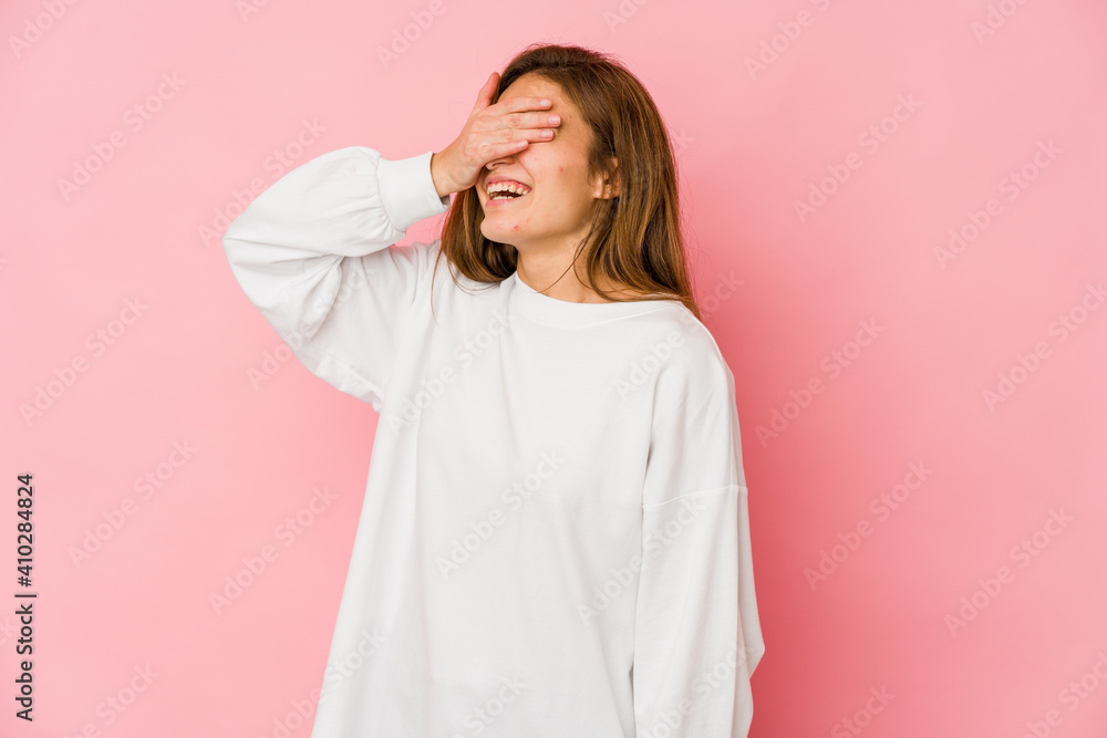 Young skinny caucasian teenager girl laughs joyfully keeping hands on head. Happiness concept. Young skinny caucasian teenager girl laughs joyfully keeping hands on head. Happiness concept.