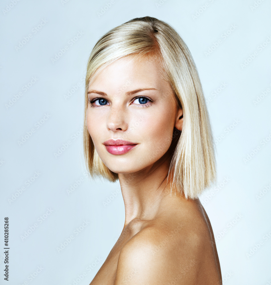 Portrait of young woman on light blue background Portrait of young woman on light blue background