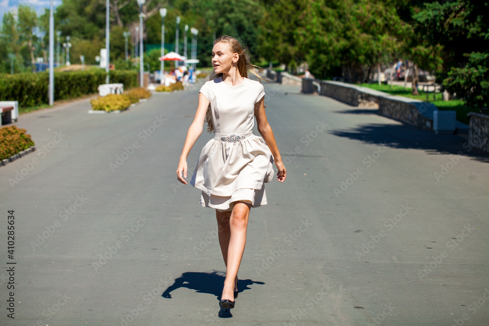 Young beautiful brunette woman in summer dress Young beautiful brunette woman in summer dress