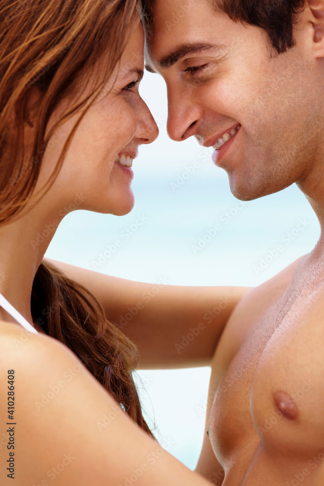 Young attractive couple enjoying summer holiday on beach Young attractive couple enjoying summer holiday on beach