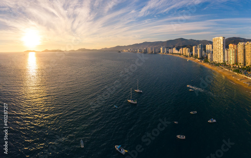 Beautiful sunset, aerial view of the beach, acapulco city seen from above. Travel and vacation concept. Colorful sunset on the beach photo