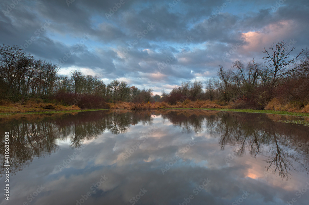USA, Oregon, Marion County, Trees and clouds reflecting in lake USA, Oregon, Marion County, Trees and clouds reflecting in lake
