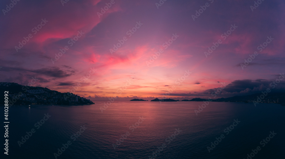 Beautiful sunset, aerial view of the beach, acapulco city seen from above. Travel and vacation concept. Colorful sunset on the beach Beautiful sunset, aerial view of the beach, acapulco city seen from above. Travel and vacation concept. Colorful sunset on the beach