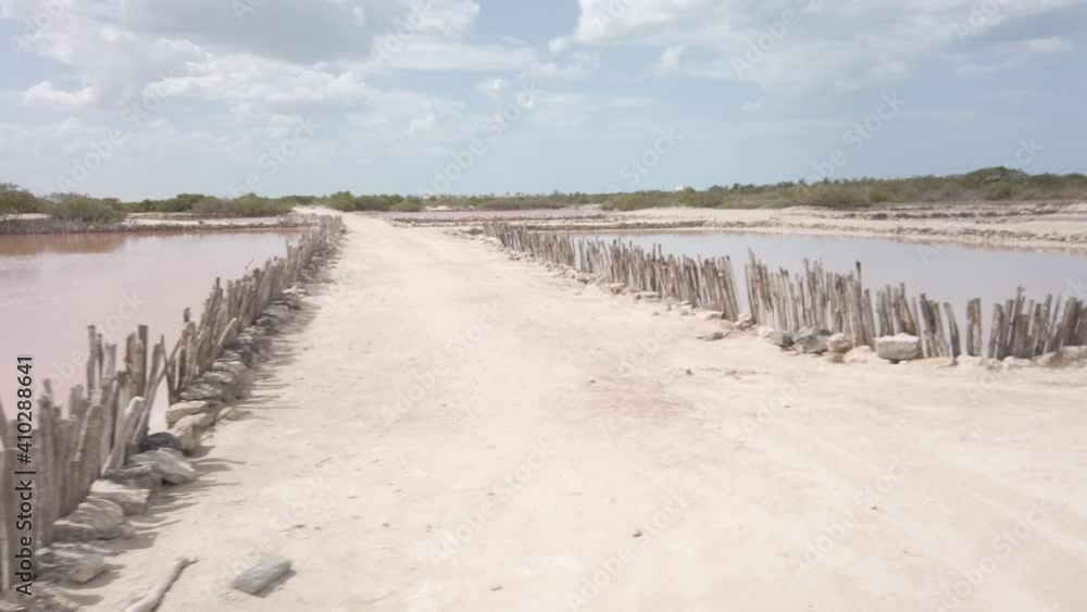 Salt ponds with pink water that the Mayans have mined since ancient time. Salt ponds with pink water that the Mayans have mined since ancient time.