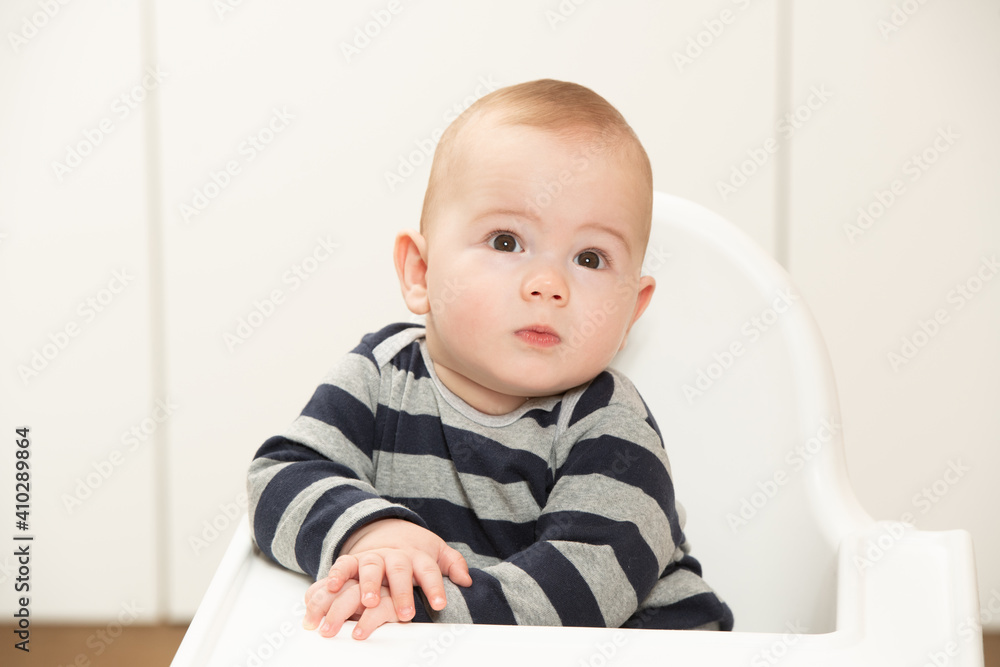 Child Sitting at Empty Table Child Sitting at Empty Table