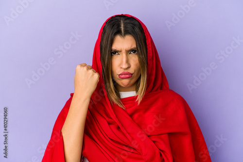 Young indian woman wearing a hijab isolated showing fist to camera, aggressive facial expression. © Asier
