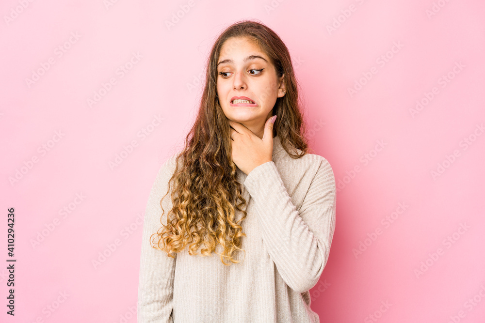 Young caucasian woman touching back of head, thinking and making a choice. Young caucasian woman touching back of head, thinking and making a choice.