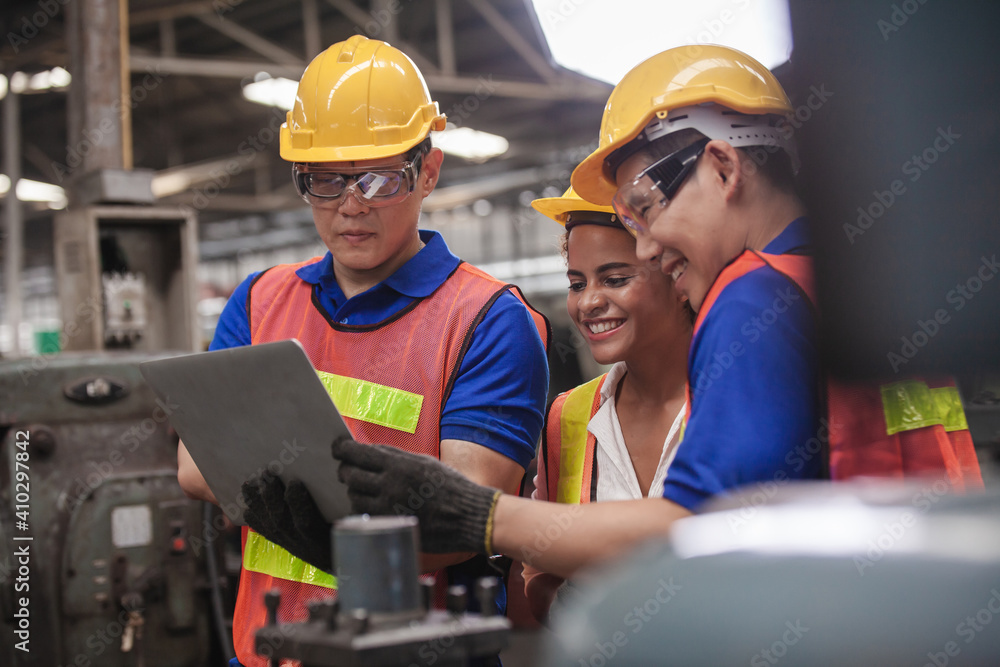 worker Industrial Engineers Talk with Factory Worker while Using Laptop. industrial worker is working. technician engineer and mentor checking process. machine metalworking industry concept copyspace worker Industrial Engineers Talk with Factory Worker while Using Laptop. industrial worker is working. technician engineer and mentor checking process. machine metalworking industry concept copyspace