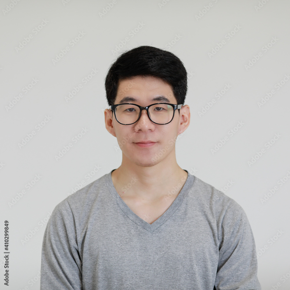 Portrait of a young and handsome Asian man on white background Portrait of a young and handsome Asian man on white background