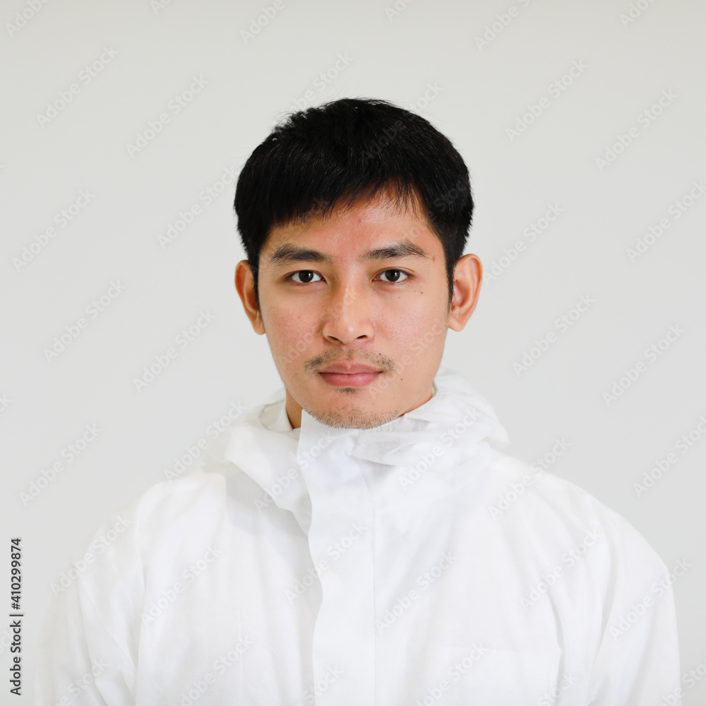 Portrait of a young and handsome Asian man wearing sterilized protection laboratory clothe Portrait of a young and handsome Asian man wearing sterilized protection laboratory clothe