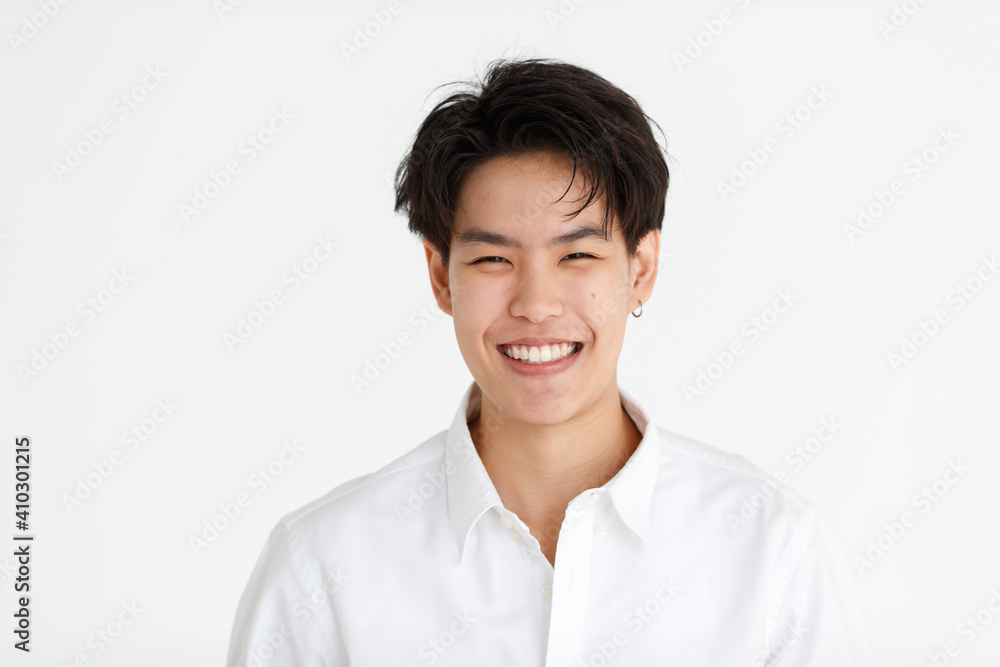 Portrait of a handsome smile face tomboy, a girl who loves to be a man, on white background Portrait of a handsome smile face tomboy, a girl who loves to be a man, on white background