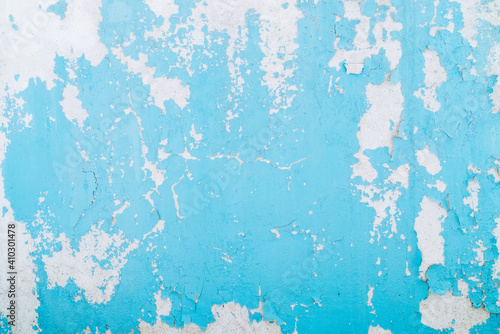 Blue paint background. Abstract blue peeling paint, mold and crack on the old concrete wall. © prasith