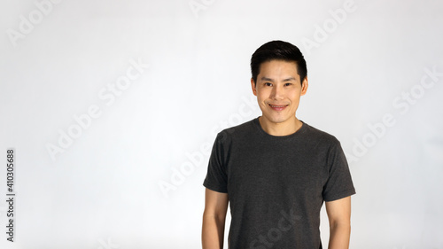 Portrait of a young and handsome Asian man with self-confident posing
