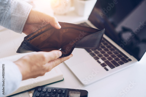 Konstfotografi Woman holds an empty purse and coins in hand meaning money financial problem or bankrupt jobless, broke after credit card payday jobless, debt