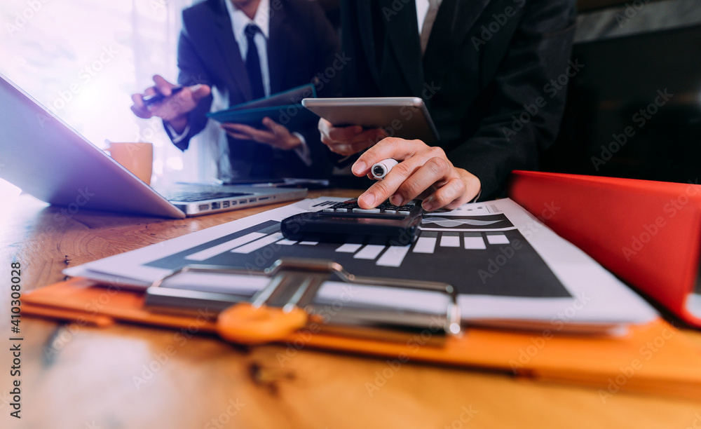 Fund managers team consultation and discuss about analysis Investment stock market by digital tablet.. Fund managers team consultation and discuss about analysis Investment stock market by digital tablet..