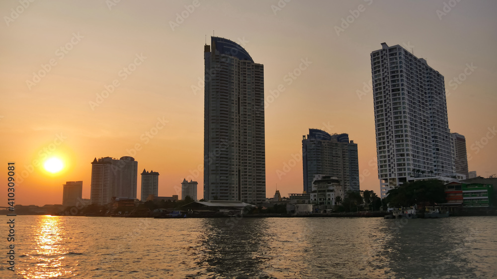 Beautiful sunset Cityscape urban of Bangkok city at Chao Praya river, Thailand