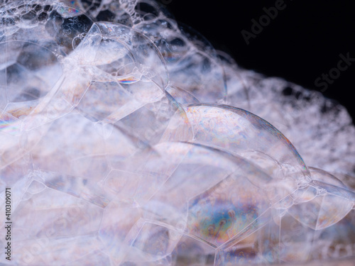 Soap bubbles. Macro shot of soap foam on black background. Close-up view.