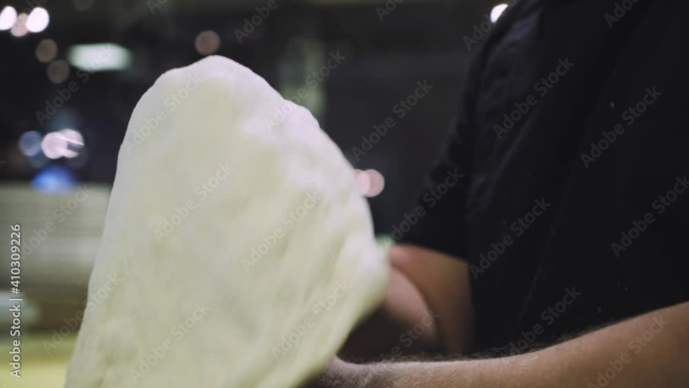 Chef is making pizza dough. Hands and dough. Cooking pizza dough. Chef preparing the dough for the pizza. Chef is making pizza dough. Hands and dough. Cooking pizza dough. Chef preparing the dough for the pizza.