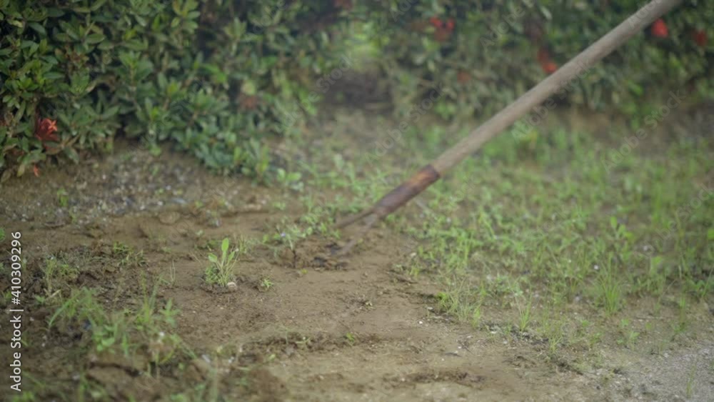 Person using garden tool shovel to remove grass turf, slow motion Person using garden tool shovel to remove grass turf, slow motion