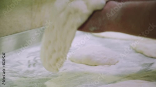 Chef is making pizza dough. Hands and dough. Cooking pizza dough. Chef preparing the dough for the pizza.