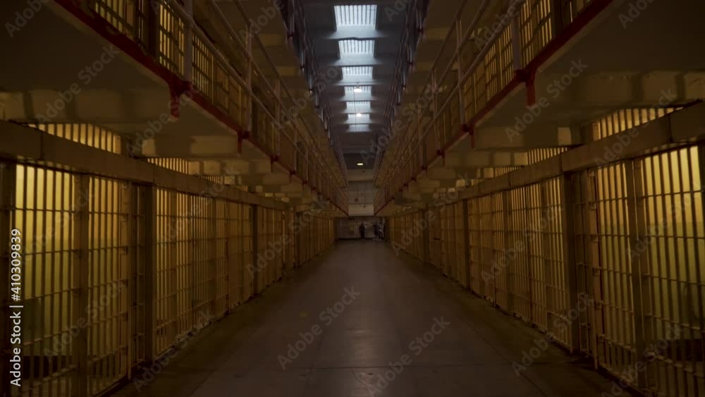 Inside Alcatraz prison, long row of cells. Concept of guilty, law or freedom Inside Alcatraz prison, long row of cells. Concept of guilty, law or freedom