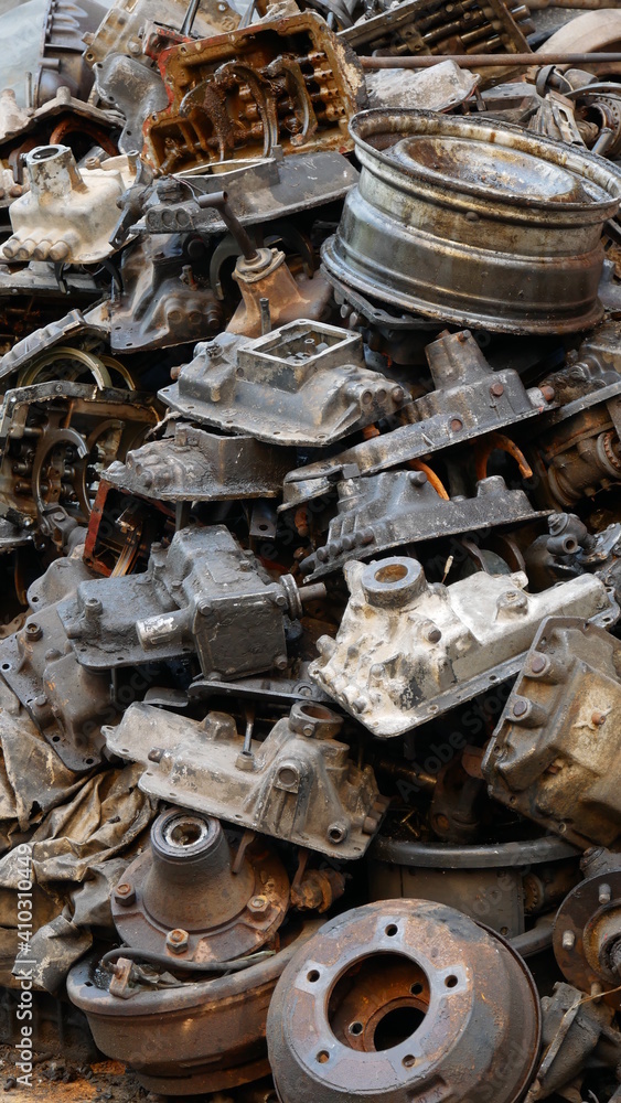 Pile of old machine parts in second hand machinery shop, background of damage and rusty old car machine Pile of old machine parts in second hand machinery shop, background of damage and rusty old car machine