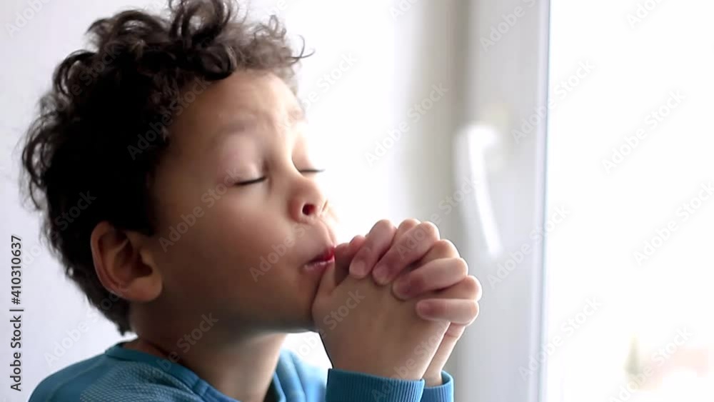 little boy praying to God with hands together stock video stock footage little boy praying to God with hands together stock video stock footage
