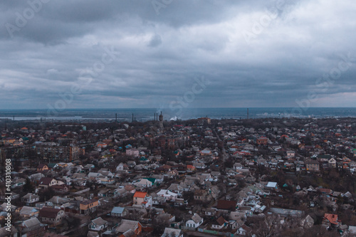 A bird's eye view of the dark blue sky over the city. Gloomy city