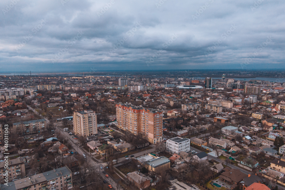 Obraz premium A bird's eye view of the dark blue sky over the city. Gloomy city