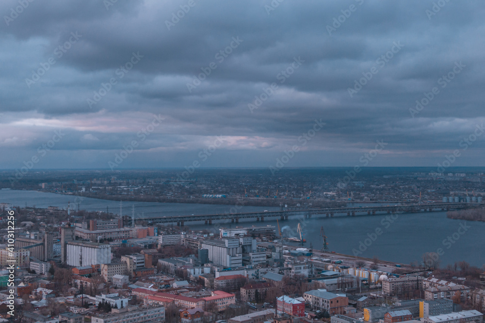 A bird's eye view of the dark blue sky over the city. Gloomy city