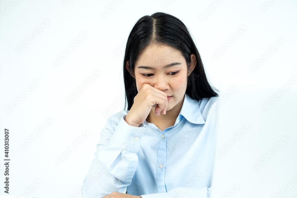 Working Asian women feel stressed, dismal tired from work, migraine headaches from hard work while working at the office Working Asian women feel stressed, dismal tired from work, migraine headaches from hard work while working at the office