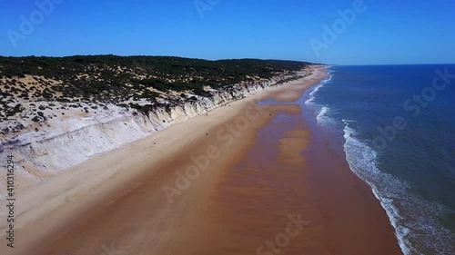 Beatiful landscape with  deep views of a vixen beach, with no buildings, and blue waters and clear sand photo