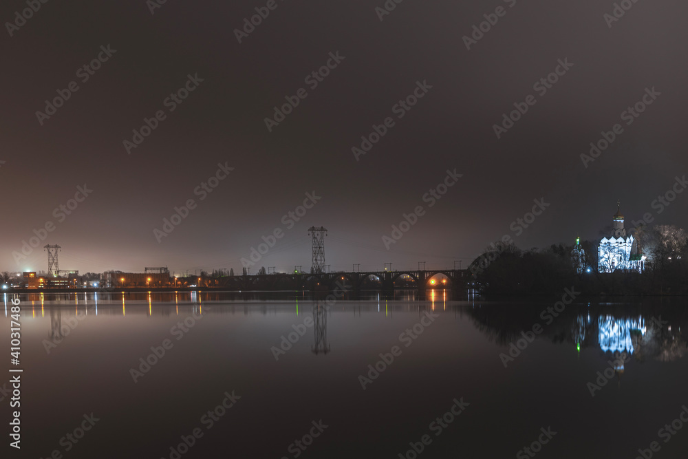 Beautiful panorama of the night city with water.