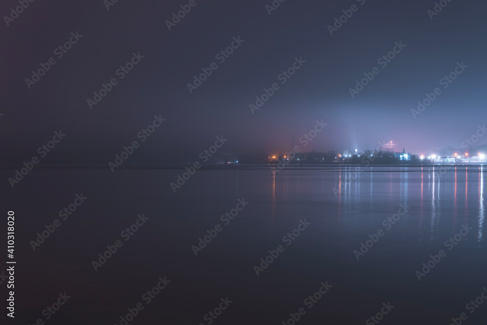 Beautiful panorama of the night city with water.