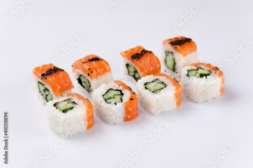 Philadelphia roll with cucumberon white background. Isolated. Sushi menu. Japanese food.