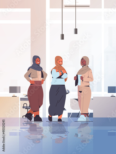 arabic businesswomen discussing during meeting arab business people standing together successful women's team concept office interior full length vertical vector illustration