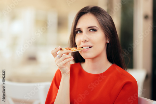 Funny Woman Eating a Pizza Slice in a Restaurant