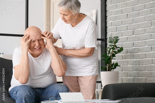 Stressed senior man at home