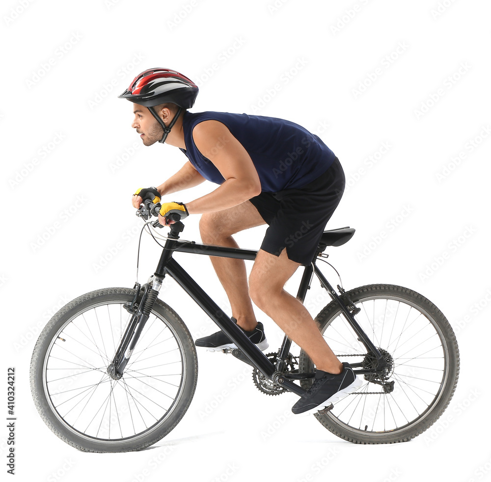 Naklejka premium Male cyclist riding bicycle on white background