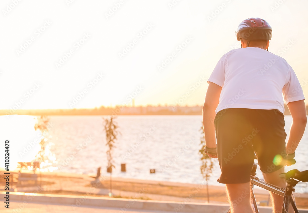 Male cyclist riding bicycle outdoors