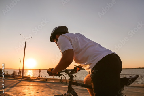 Male cyclist riding bicycle outdoors