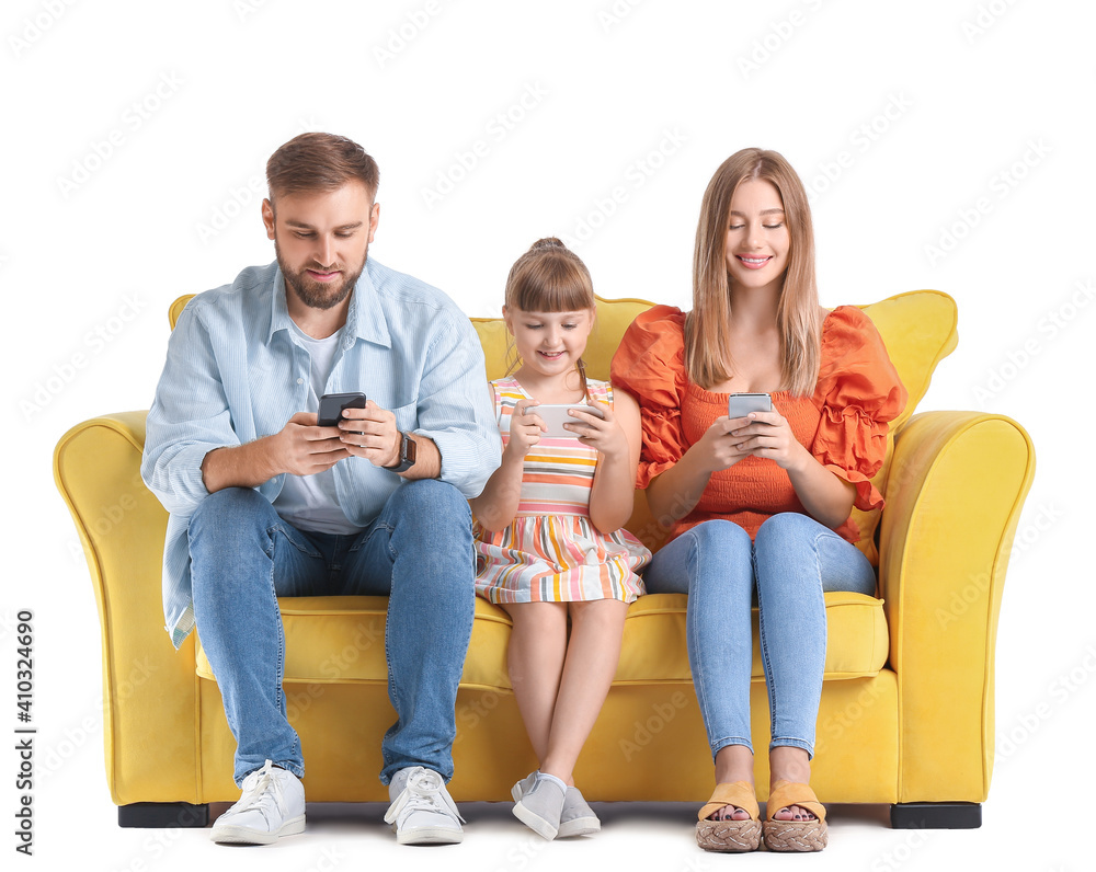 Happy family with mobile phones on sofa against white background