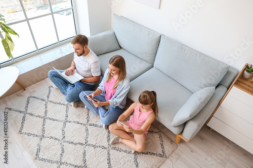 Happy family with modern de...