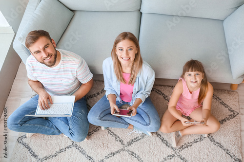 Happy family with modern de...