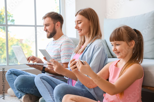 Family using modern digital...