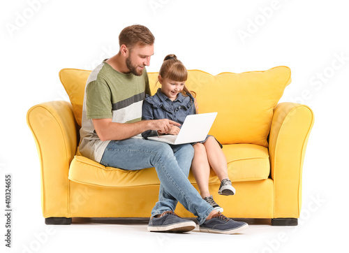 Father and daughter with laptop on sofa against white background