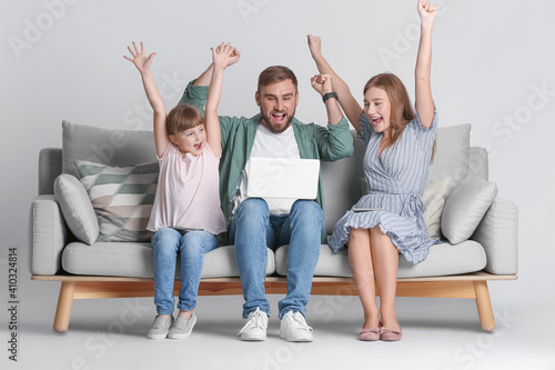 Happy family with modern la...