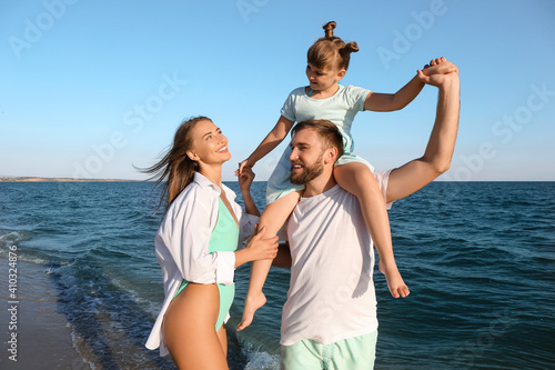 Happy family on sea beach